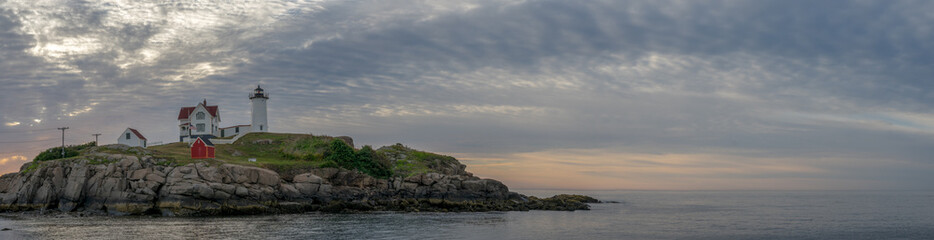 Fototapeta na wymiar Nubble Lighthouse at sunrise, Cape Neddick, York, Maine