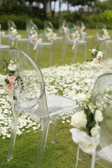 Wedding arch, chairs for guests, wedding accessories and decorations. Wedding ceremony. Beautiful wedding setup.