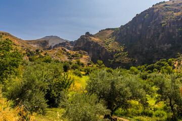 Fototapeta premium A view across the Sierra Nevada mountains outside Monachil, Spain in the summertime