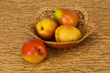 Pear heap in the wooden basket