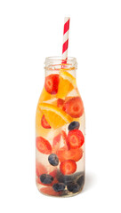 Cold fresh detox beverage of blueberry strawberry orange in glass bottle, isolated on white background