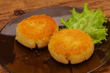 Vegan cuisine - Potato cutlet in the plate