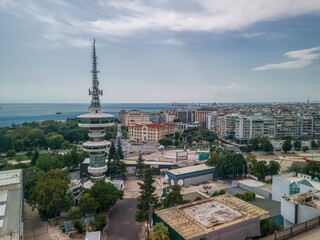 Naklejka premium Thessaloniki, Greece aerial drone view of empty International trade TIF fair. Day south view panorama of HELEXPO premises without crowd, OTE Telecommunications Tower & White Tower landmark visible.