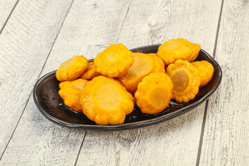 Marinated yellow patisson in the bowl