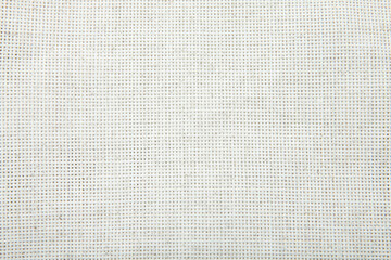 White napkin tablecloth . Wrinkled fabric background top view.