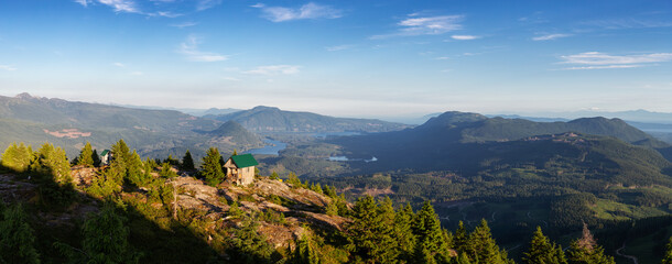 Panoramic View of Tin Hat Cabin on top of a mountain during a sunny summer evening. Located near Powell River, Sunshine Coast, British Columbia, Canada.