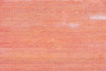 Fototapeta premium Red brick wall background ouside of the house.