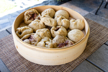 Japanese Nikuman dumplings in a bamboo steamer