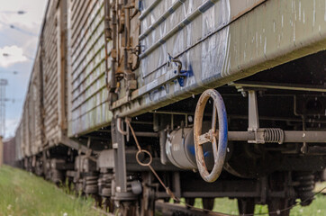 Naklejka premium Railroad train freight wagons compound and other wagon parts.