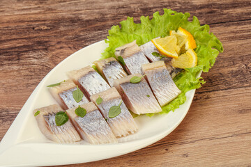 Herring fillet with sliced lemon