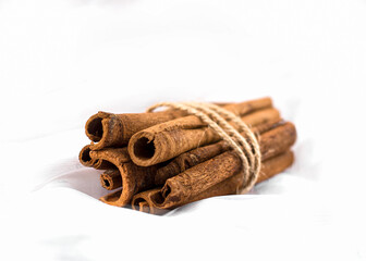 
Fragrant cinnamon sticks on a white background