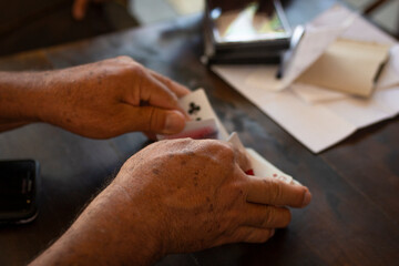 Medellin, Antioquia / Colombia. September 17, 2018. People playing card game card (Detail)