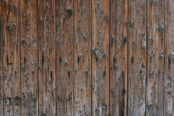 Vintage wood background texture with knots and nail holes.