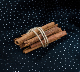 cinnamon sticks on a dark background