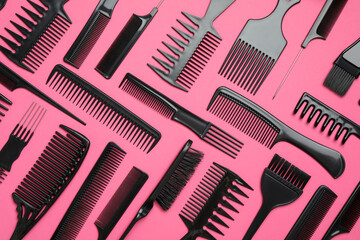 Flat lay composition with modern hair combs on pink background
