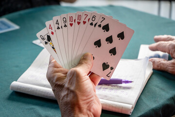Medellin, Antioquia / Colombia. September 17, 2019. People playing card game card (Detail)
