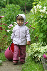 a child runs with a bucket
