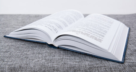 new open book on a gray table