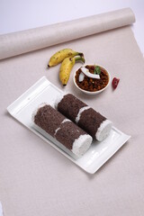 Ragi Puttu or Finger Millet  steamed cake with bengal gram curry
