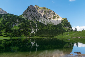Naklejka na ściany i meble The mountain Rubihorn in Germany with the lake Gaisalp in the foreground