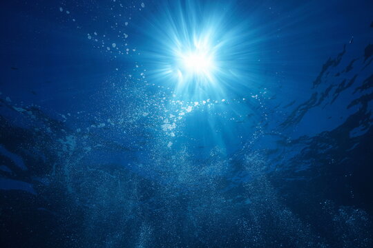 Sunlight underwater with air bubbles rising to water surface, natural  scene, Mediterranean sea Stock Photo | Adobe Stock