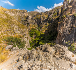 A view into the gorge of Monachil river in the Sierra Nevada mountains, Spain in the summertime