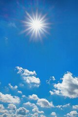 blue sky with white clouds and bright sun as a natural background