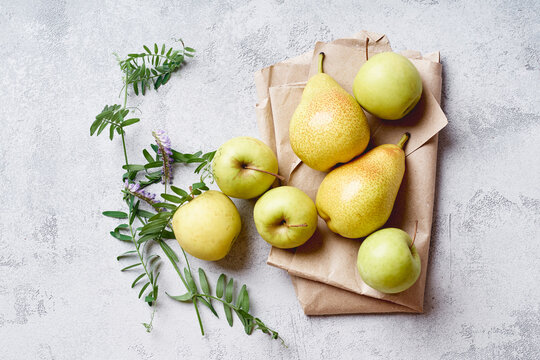 Fresh Apples And Pears With Wild Flowers Viewed From Above