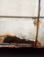 Old broken and rusty car detail
