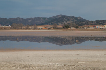 Mountains reflected in a lagoon. Gallocanta Lagoon Natural Reserve. Aragon. Spain.