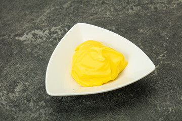 Natural cheese sauce in the bowl