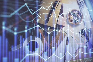 Double exposure of forex graph drawing and work table top veiw. Concept of financial analysis.
