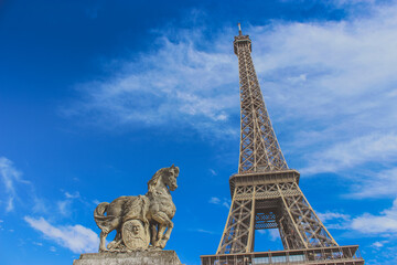 Fototapeta na wymiar The Eiffel tower in Paris, France with the horse statue, vintage style