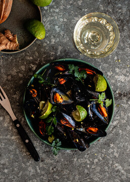 Steamed mussels in bowl on the table