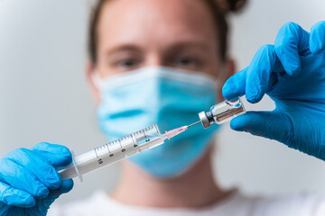 Medical worker preparing vaccine for corona-virus, cure for virus disease