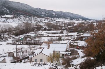 Houses and rural landscape covered with snow. Sabiñanigo Alto. Huesca. Aragon. Spain.