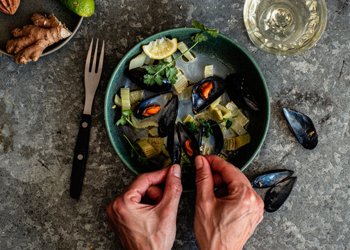 Steamed mussels in bowl on the table