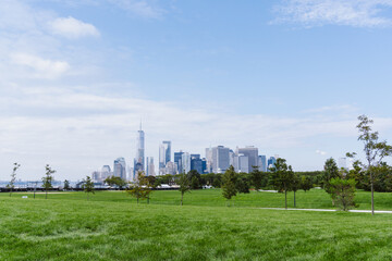 Fototapeta na wymiar A view of Financial district in Lower Manhattan seen from Governors Island. Aerial of downtown Manhattan