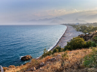 Konyaalti beach and the Mediterranean sea, Taurus Mountains in the background. Antalya TURKEY