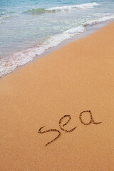 Inscription of the word Sea on the ocean. Beautiful sea landscape.