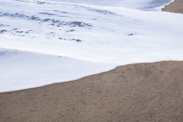 sea foam over the beach