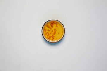 Quince jam in bowl on white background
