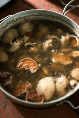 Boiled Suillus mushrooms in an old pot.