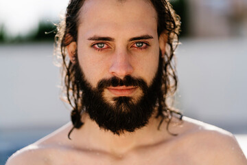 Portrait of a man with beard and wet hair