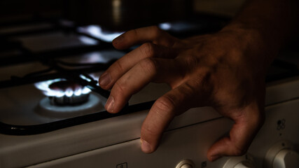 My hand on the kitchen cooker near the fire