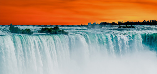 Horseshoe Falls of Niagara Falls, Ontario, Canada with Sunrise background