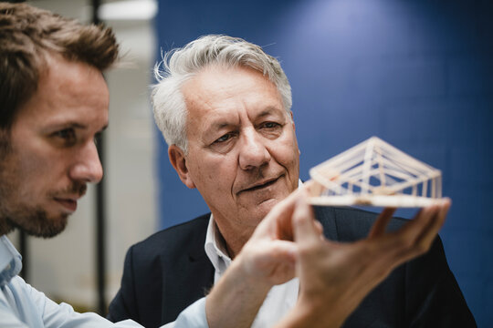 Architect presenting architectural modell to client