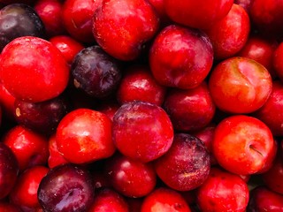 red plums on market