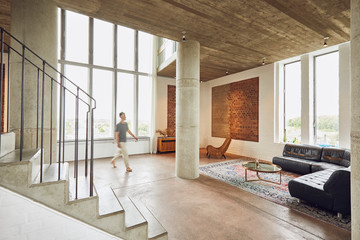 Man walking in a loft flat