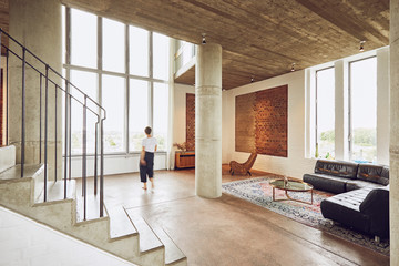 Woman walking in a loft flat